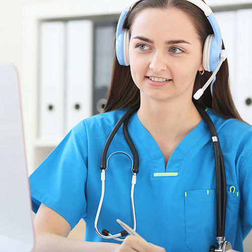 Health support specialist wearing scrubs and phone headset