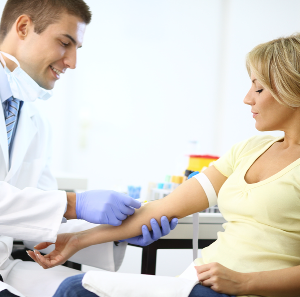 phlebotomist drawing blood for women