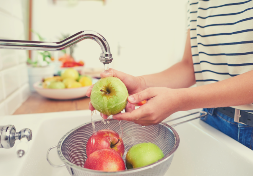 lady washing fruits