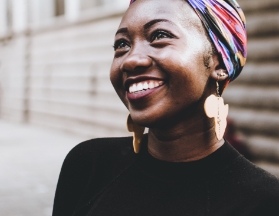 Happy woman smiling looking up at something