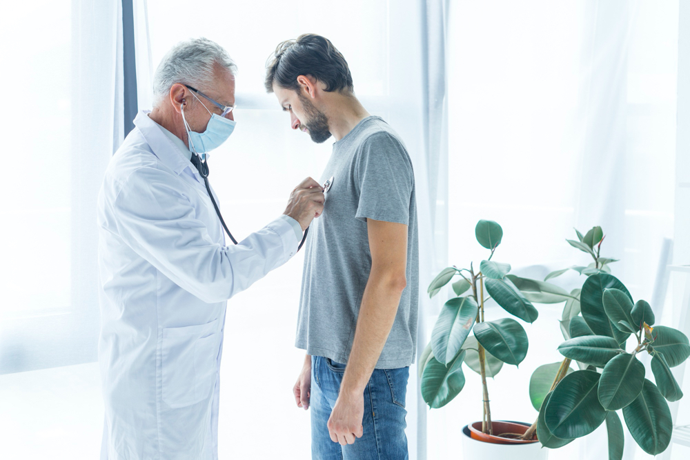 doctor checking patient
