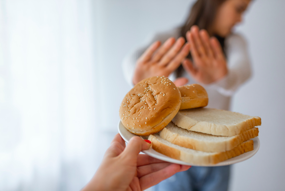 young woman suffers from a gluten.