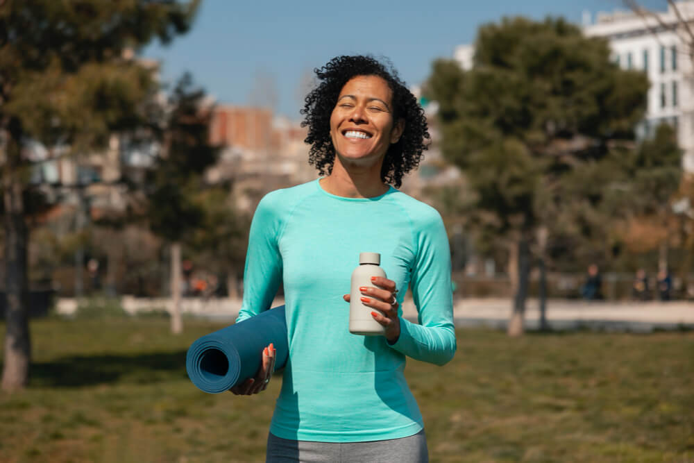 Senior woman exercising outdoors in the park