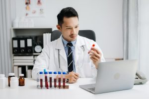 Doctor reviewing blood samples while handling online blood test orders in Jacksonville