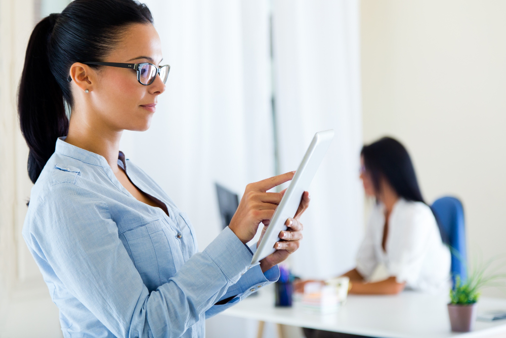Professional travel nurse reviewing clinical compliance titer requirements on a tablet.